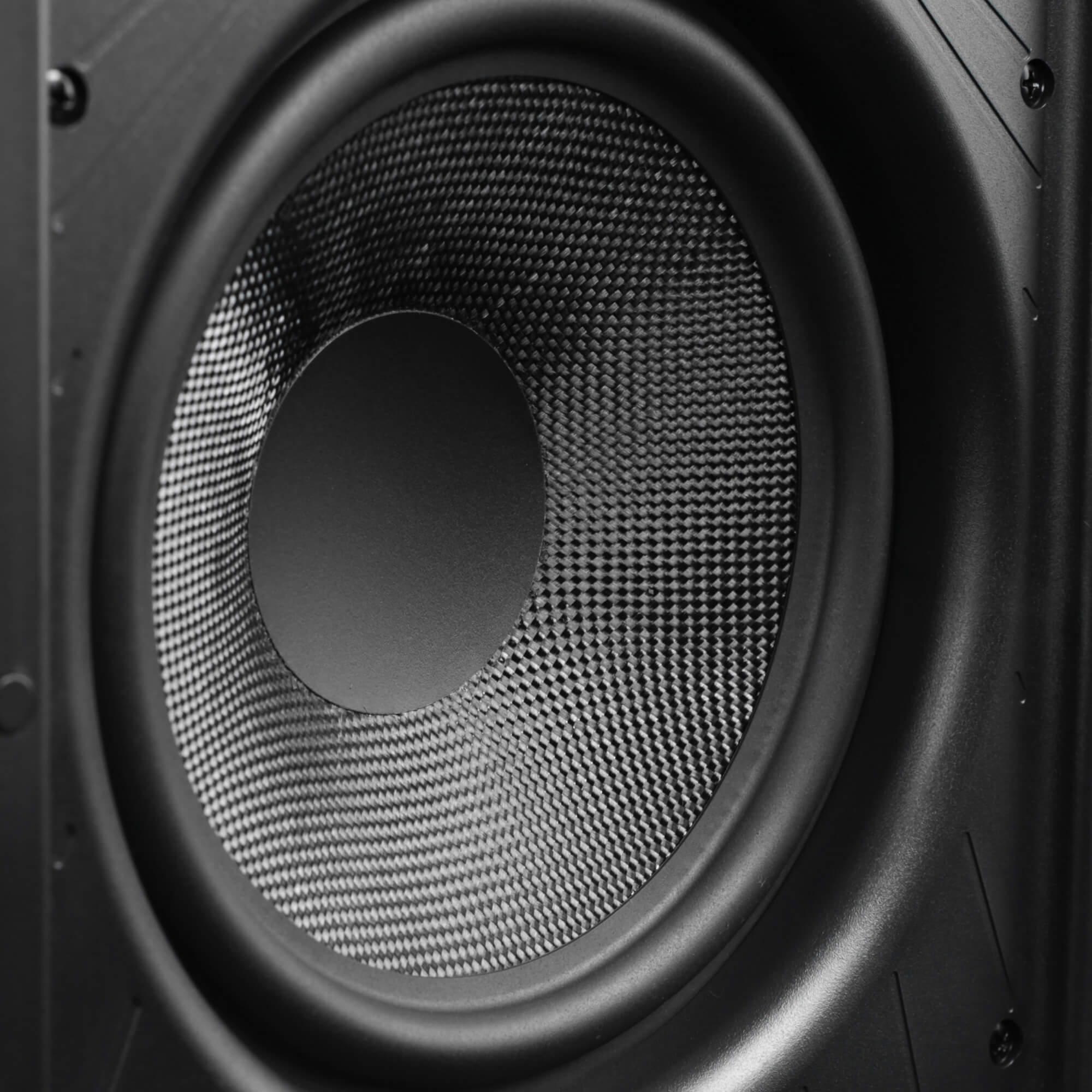 Close-up of a speaker cone with a woven surface