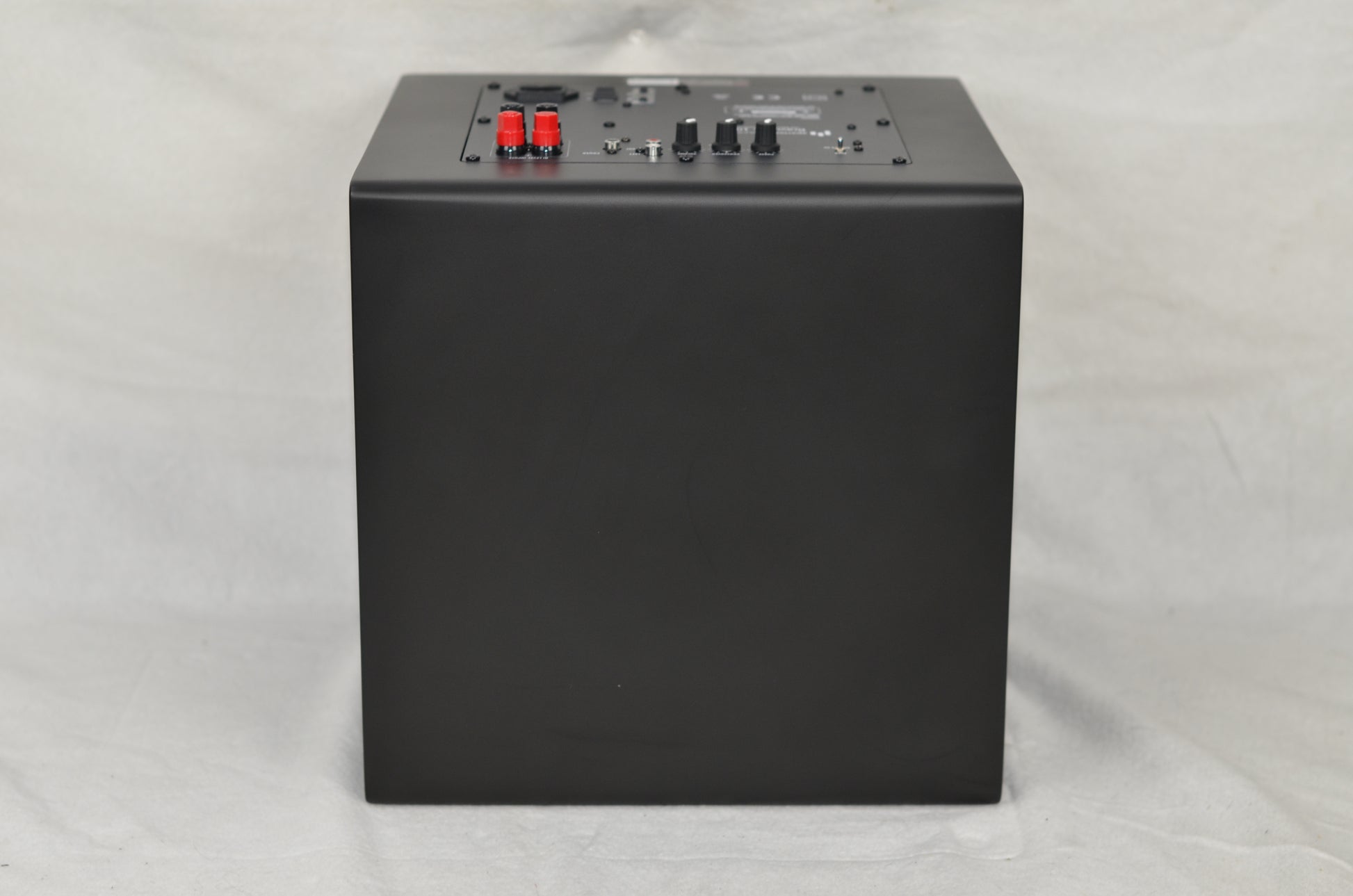 The Aperion Audio Bravus II 12D Subwoofer laying on its front looking at the top.