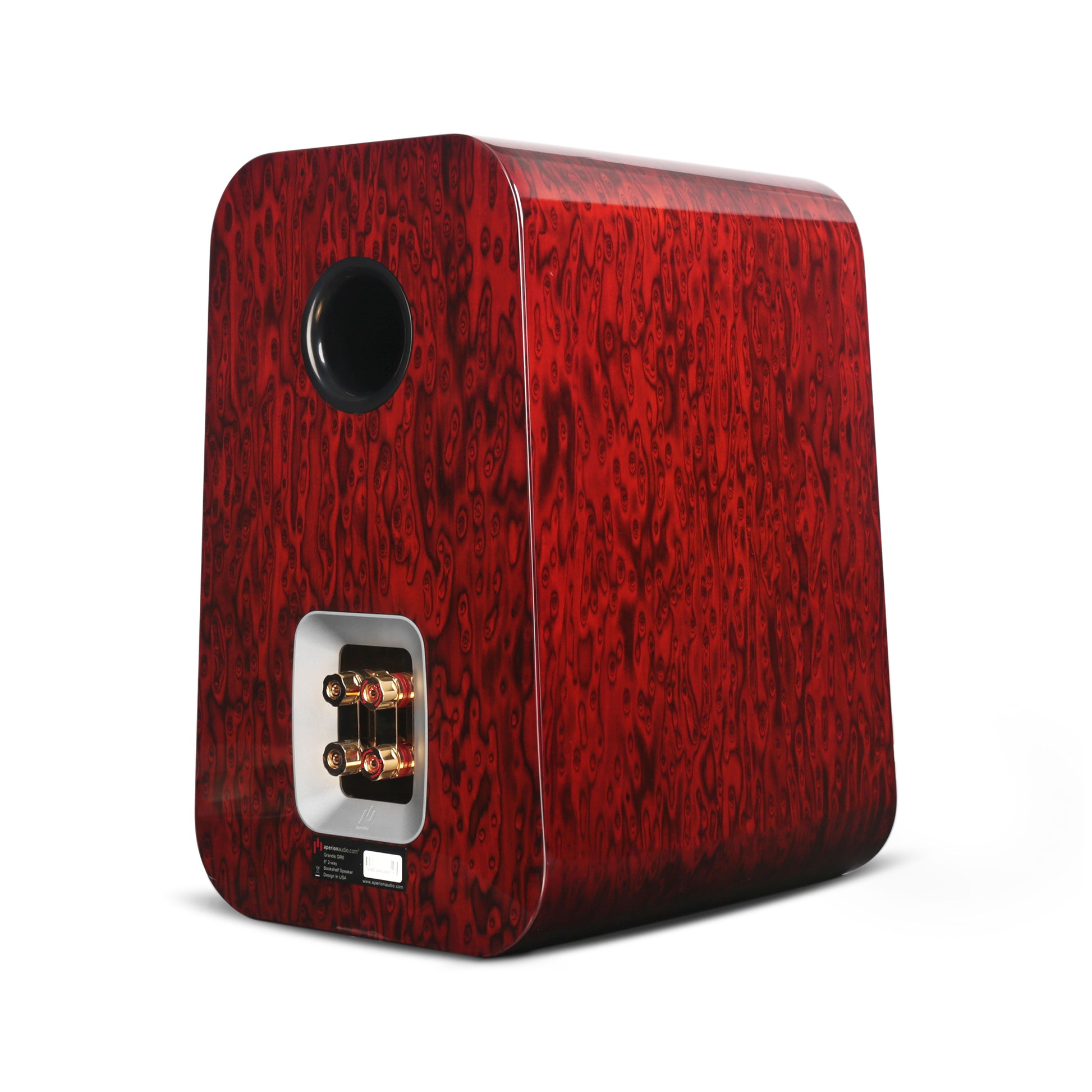 Back right side view of Aperion Grandis GR8 Bookshelf speaker in Gloss Rosewood opal finish.  Shown are 2 pairs of oversized gold plated binding posts with jumper bar and a black port tube. 